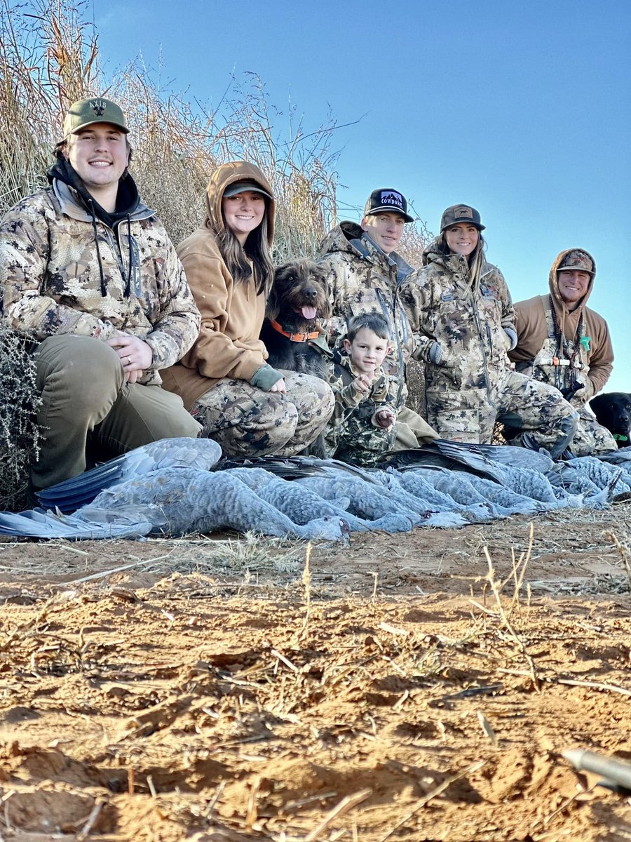 Group of hunters with hunting dog